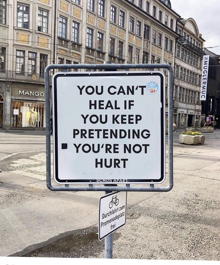 a sign that says you can't heal if you keep pretending you're not hurt