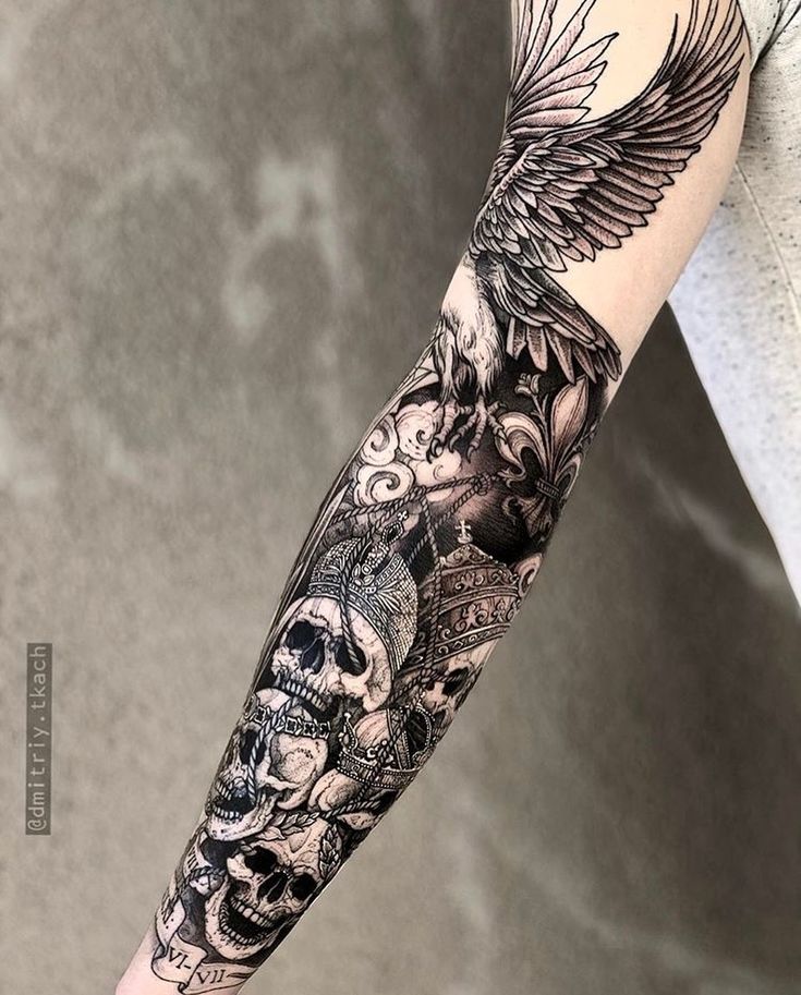 a person with a black and white tattoo on their arm