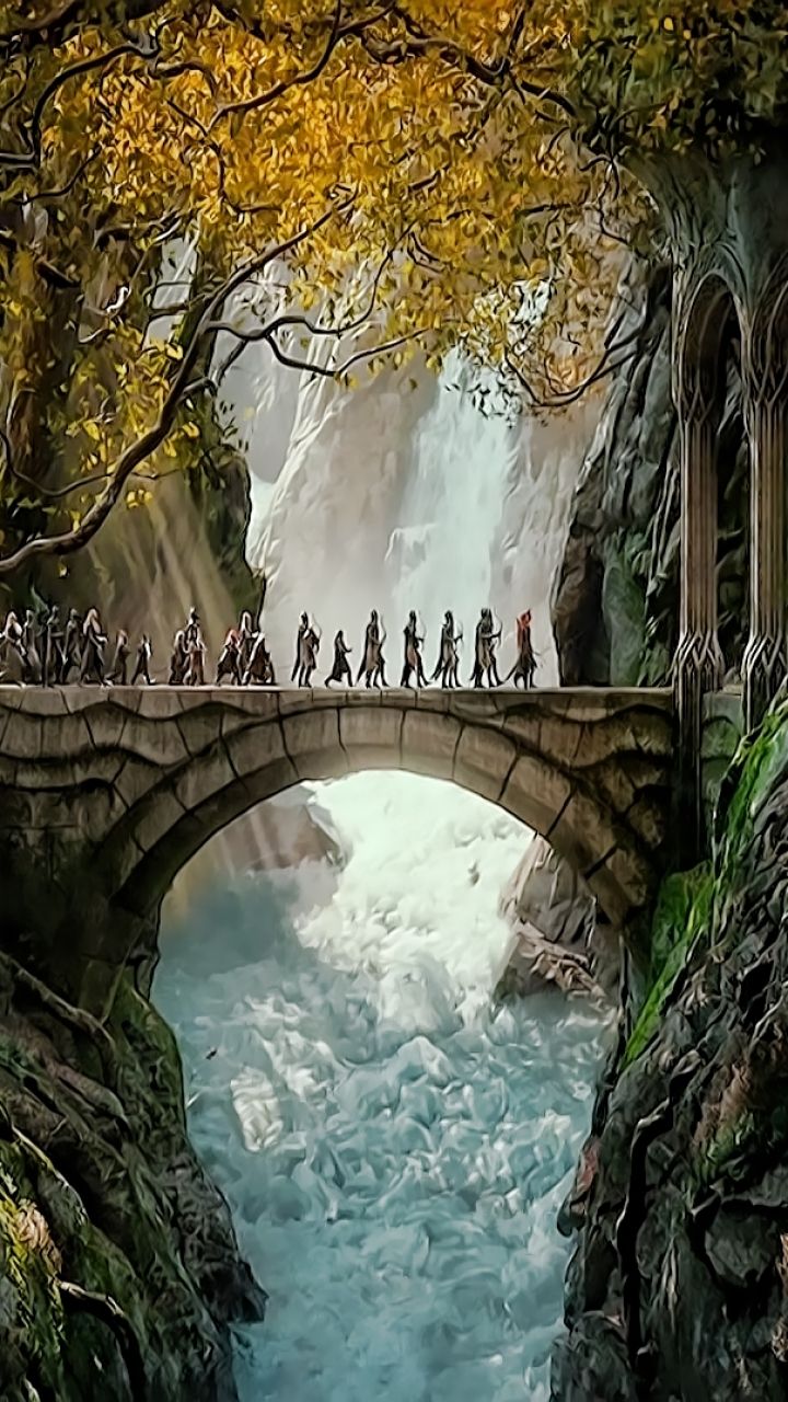 people walking across a bridge over a river with a waterfall in the backgroud