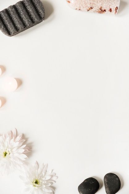 some rocks and flowers on a white surface with a place for the word love written in it