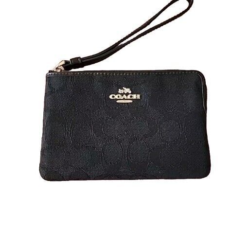 Coach Signature Logo Wristlet Black Small Purse F58033.  NICE!  VERY GOOD "Pre-owned" Condition.  Normal wear.  NO Bag Charm.  Two card slots.  Please ZOOM in on alll pictures as they are part of the description.   A friendly reminder I am a No Refund /No Return seller so serious buyers only.   Any questions or concerns will be answered and additional pictures will be taken upon request.  Thank you. Black Small Purse, Coach Wallets, Coach Wallet, Bag Charms, Friendly Reminder, Small Purse, Signature Logo, Outfits Fashion, Fashion Items