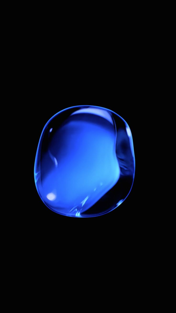 an image of a blue glass object in the night sky with no light on it