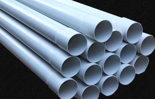 several white pipes stacked on top of each other