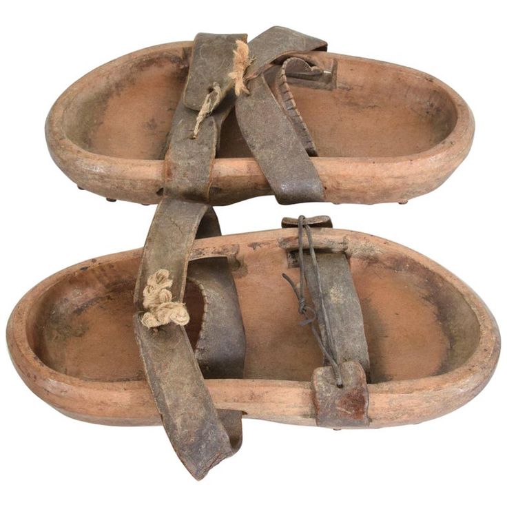 Antique Asian wood clog shoes double leather strap open toe sandals with cleats 19th century Japan Pair of antique wood iron & leather Primitive garden sandals shoes clogs with cleats -metal spikes on sole. Splendid character in Original antique unrestored unaltered Preowned condition. Unsigned. No information on the maker. Dimensions: 11.5 L x 5 W x 2.25 tall (each). inches Original vintage unrestored condition. Patina present. The leather is worn. Perfect decorative item. Refer to images. Japanese Shoes, Gardening Shoes, Medieval Garb, Beautiful Character, Garden Shoes, Metal Spikes, Clog Shoes, Decorative Wood, Metal Tree