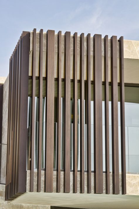 a building with wooden slats on the outside