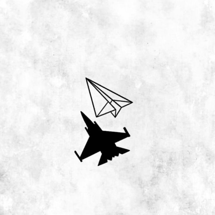 an airplane and a paper plane flying in the sky