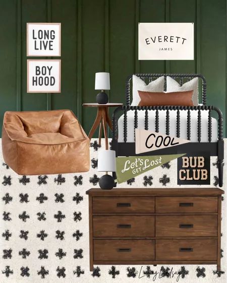 a bedroom with green walls and black and white decor on the wall, including a brown leather chair