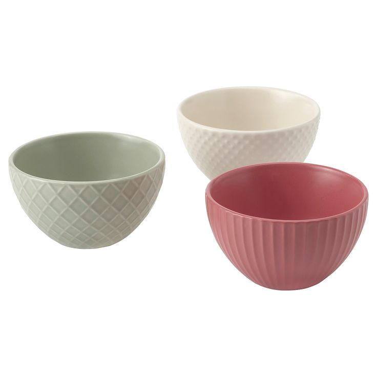 three bowls are shown in different colors and sizes, one is pink, the other is white