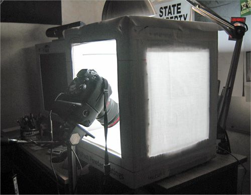 an image of a camera set up in front of a light box for photography and video production