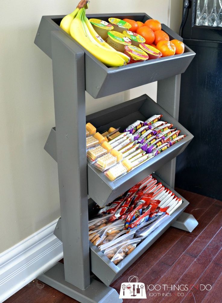 a shelf filled with lots of different types of food on top of a wooden floor