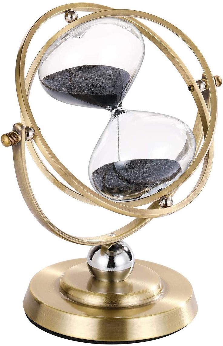 an hourglass sitting on top of a metal stand with two black sand in it