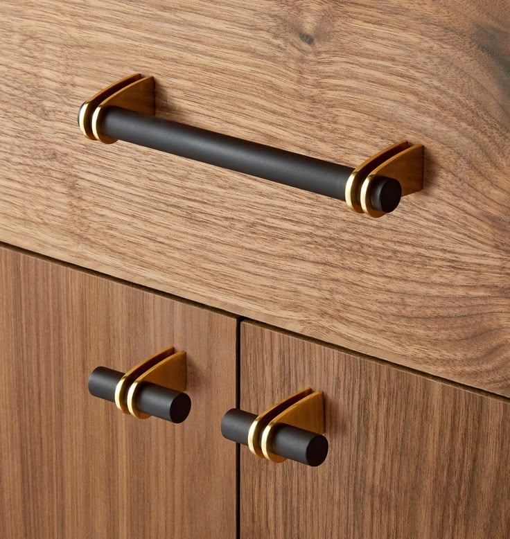 an image of wooden drawers with brass handles