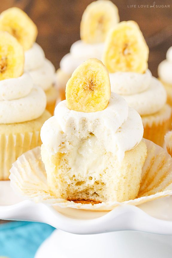 cupcakes with white frosting and bananas on top