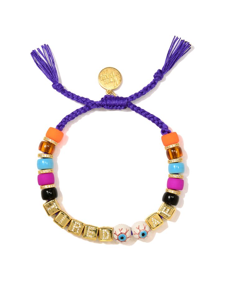 Don't let yourself go down the rabbit hole of exhaustion: slip on this bracelet for a stylish pick-me-up! This accessory features an adjustable purple threadwork and dazzling charms, including glass pave rhinestone accents and ceramic eyes. 6" Adjustable purple threadwork Drawstring closure (extendable up to 8") Gold plated brass hardware Glass charms Pave rhinestone charms Ceramic charms Handmade in New York City and Puerto Rico. Due to the handmade nature of our products, some charms may vary Adjustable Purple Bracelets, Purple Bracelets With Adjustable Chain, Bracelets Business, Tired Af, Ceramic Eye, Ceramic Charms, Down The Rabbit Hole, The Rabbit Hole, Glass Charms