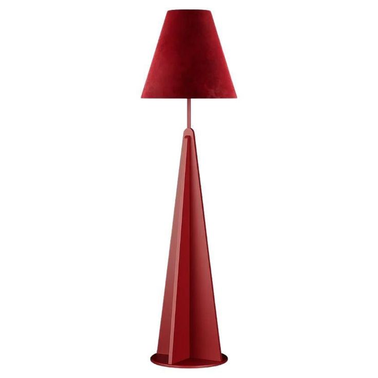 a red lamp on a white background with a red shade in the center and bottom