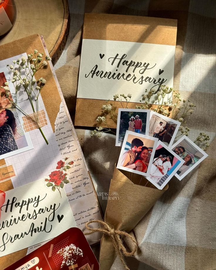 an envelope with some pictures on it next to other greeting cards and papers that say happy anniversary