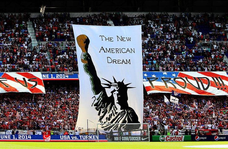 an american dream banner in the middle of a baseball field