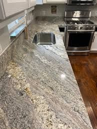 an image of a kitchen setting with granite counter tops