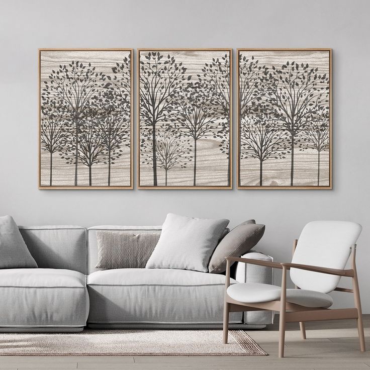 a living room with two paintings on the wall