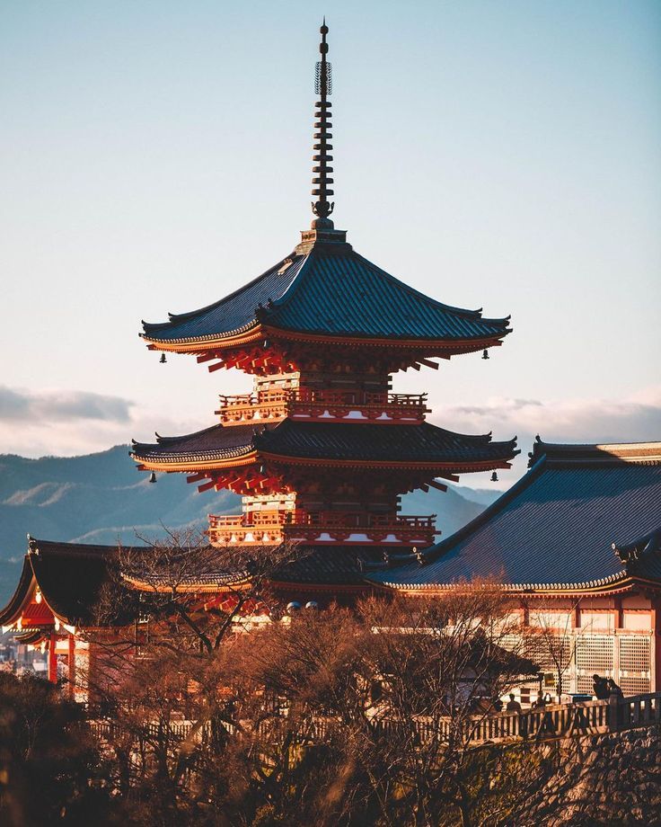 a tall building with many spires on top of it