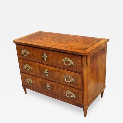 an antique chest of drawers with brass handles