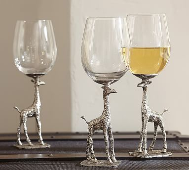 three wine glasses with giraffes on them