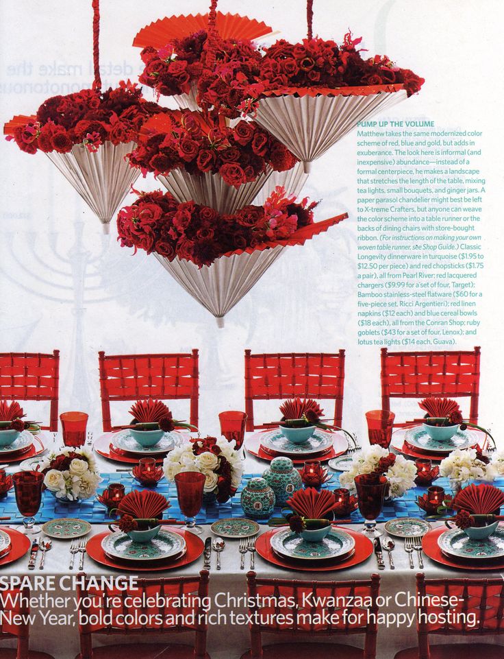 a magazine cover with red and white flowers hanging from it's centerpieces