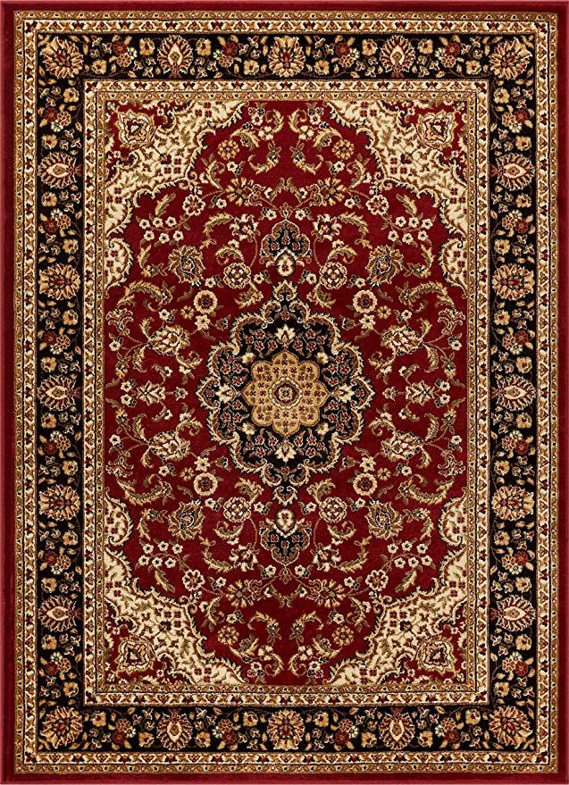 a red and black rug with an ornate design