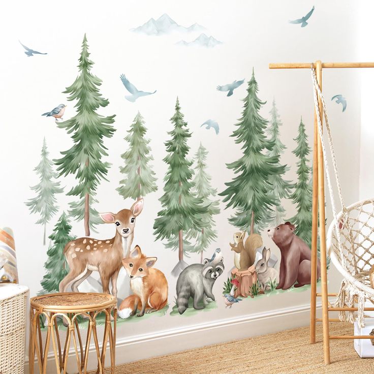 a wall with animals and birds painted on it in front of a forest scene mural