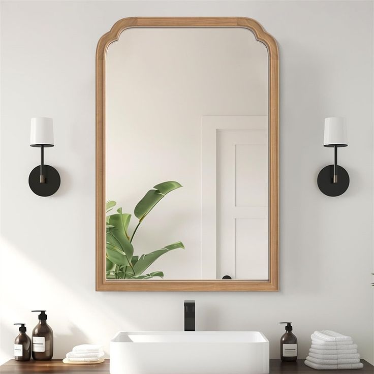 a bathroom sink with a mirror above it