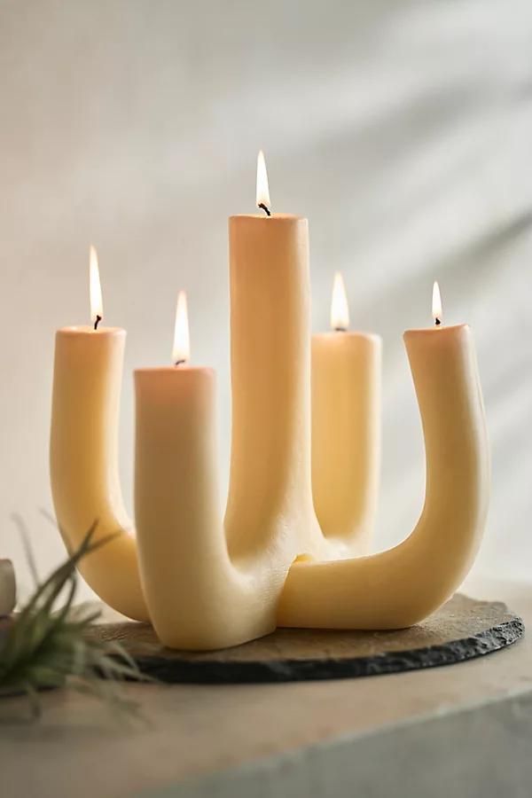 a group of candles sitting on top of a table