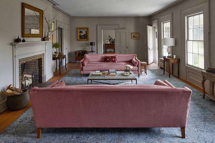 a living room filled with furniture and a fire place