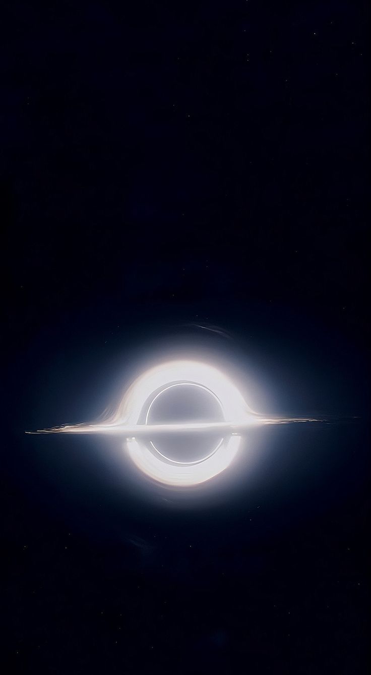 an image of a black hole in the sky with a white ring around it that is glowing