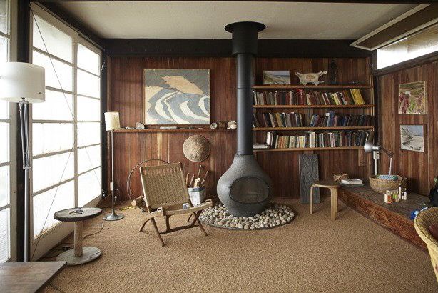 a living room filled with furniture and a fire place