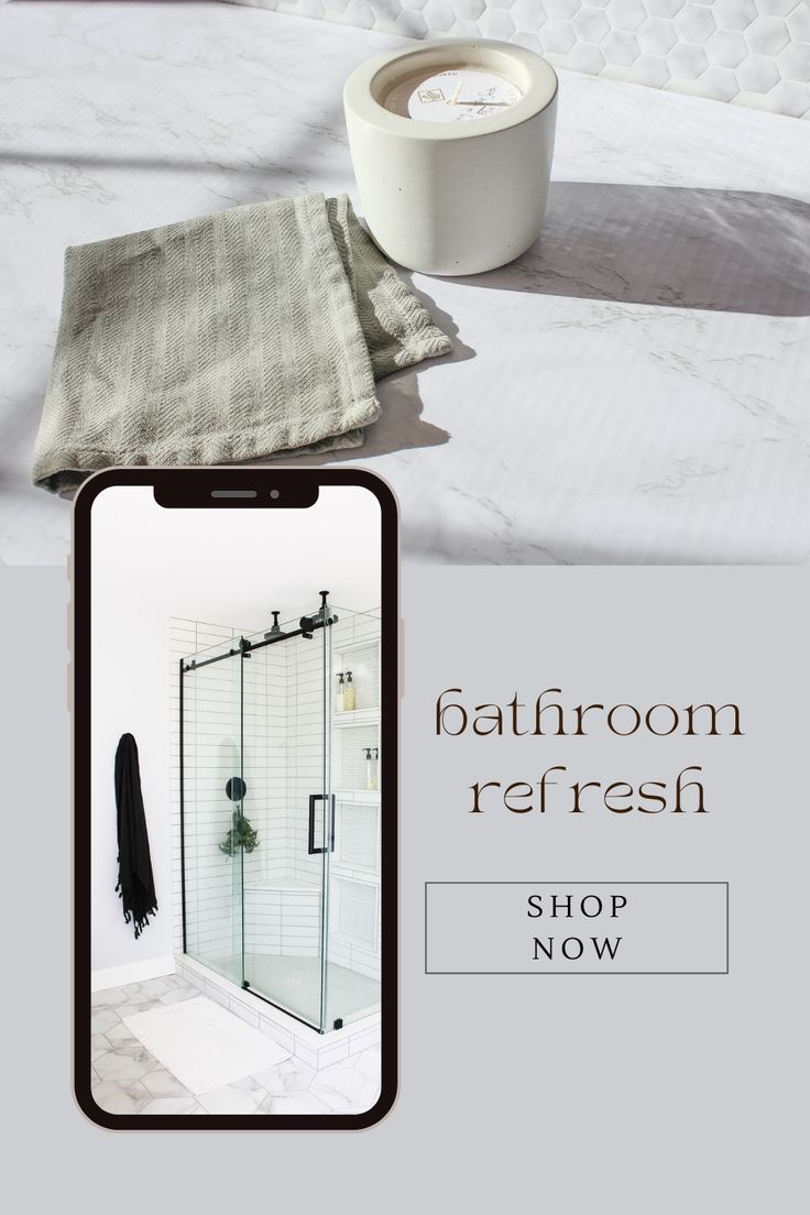 Bathroom refresh - shop now. A phone preview shows a white tile shower with a glass barn door with a white bath mat and black turkish towel hanging on the wall. A white concrete candle that smells like early summer when the honeysuckles are blooming sits next to a grey washcloth on the counter. Shop Bedding, Bed And Bath, Bathroom Refresh, Simple Bathroom, Turkish Towels, Bath Mats, Bedding Shop, Bathroom Renovation, Bathroom Inspiration