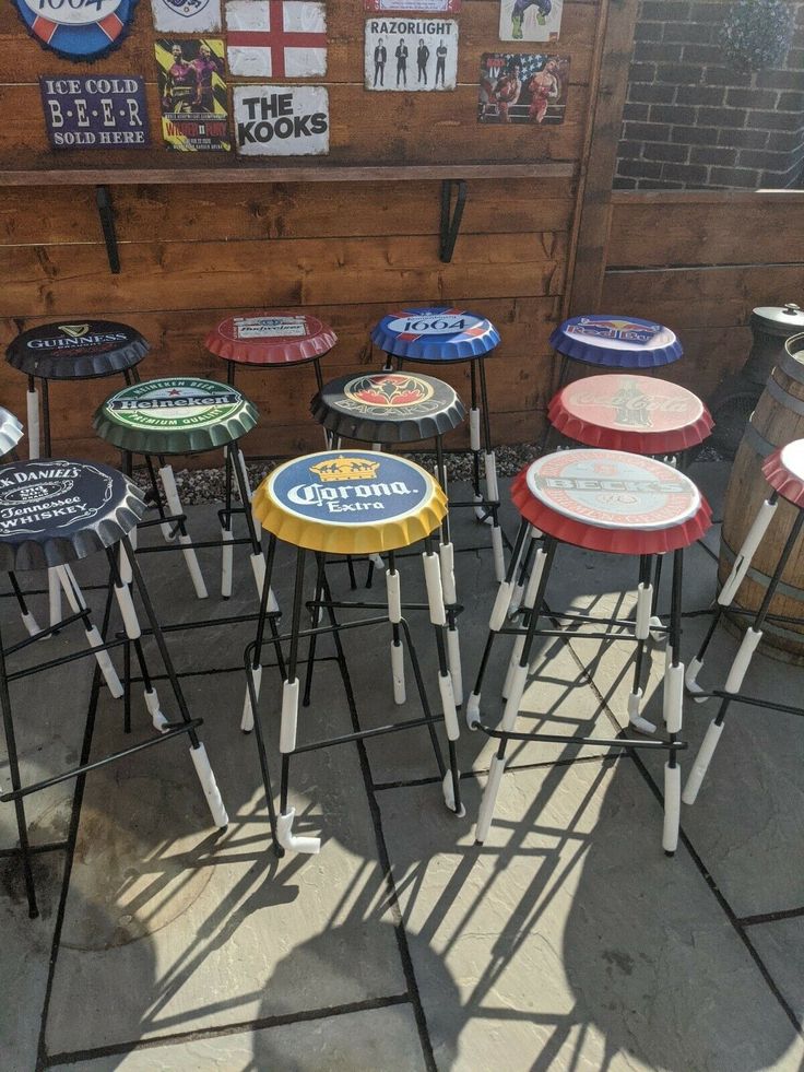 there are many stools that have been painted on them