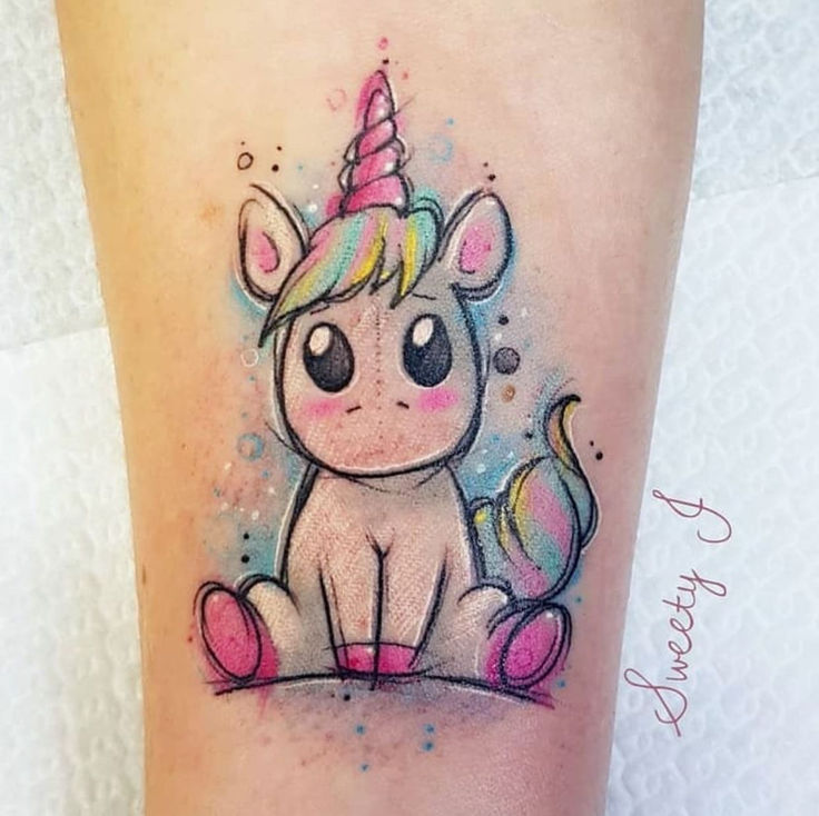 a small unicorn tattoo on the leg