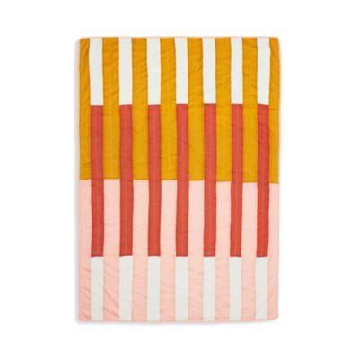 an orange and yellow quilt on a white background