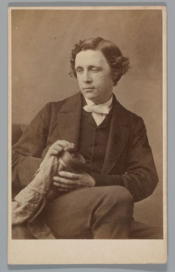 an old black and white photo of a man in a suit holding a baseball glove