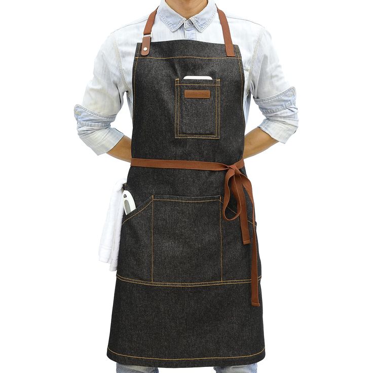 a man is wearing an apron and has his hands on his hips