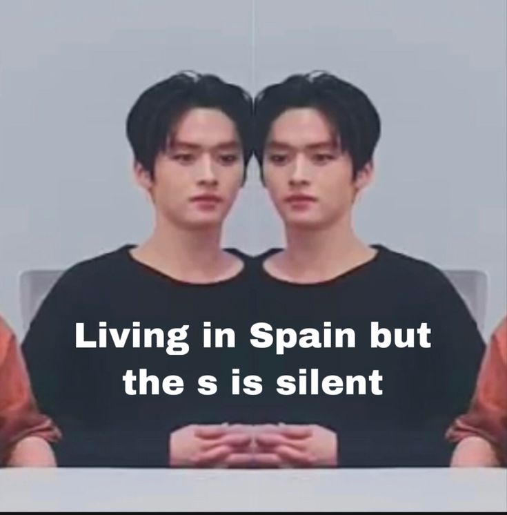 two young men sitting at a table with the caption living in spain but the s is silent