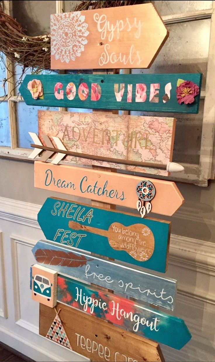 a wooden sign that says good vibes, dream catchers and other words on it