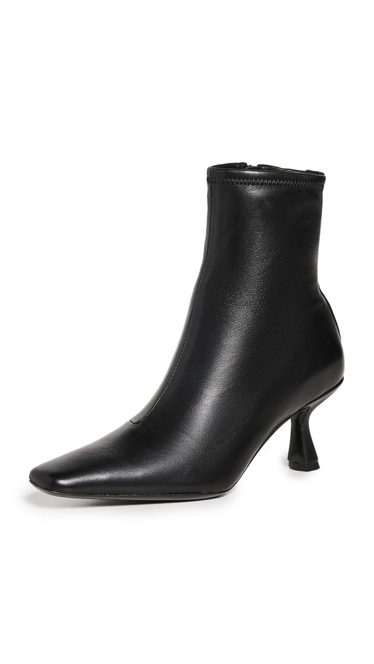 PRICES MAY VARY. Leather sole with rubber heel cap Padded leather footbed Heel: 2.75in / 70mm Leather lining Square toe Thandy Curved Heel Ankle Boots Ankle Shoes, Chunky Heels Boots, Black Heel Boots, Heel Ankle Boots, Heel Caps, Loeffler Randall, Ankle Bootie, Shoes Booties, Suede Ankle Boots