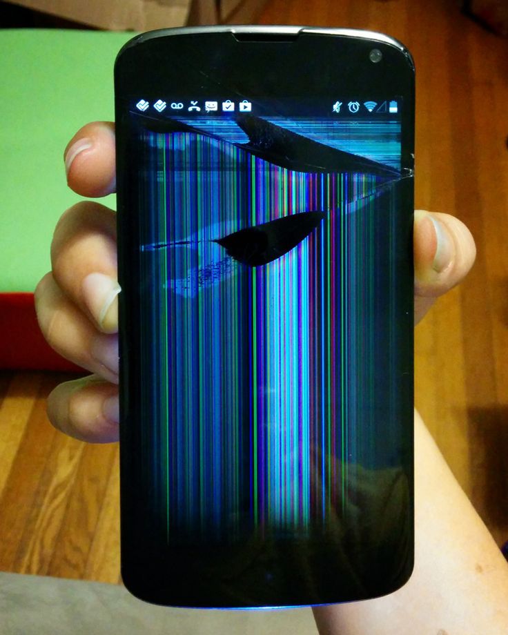 a person holding up a cell phone with an image of a plane on the screen