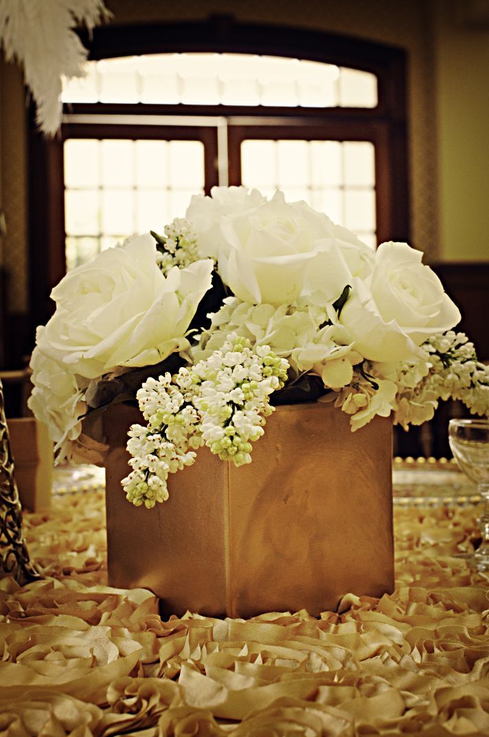 a vase filled with white flowers on top of a table