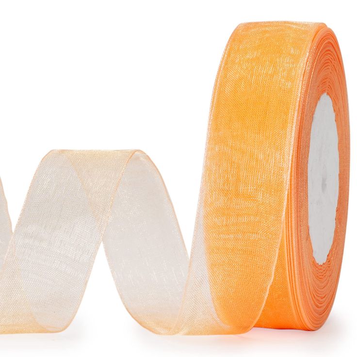 a roll of orange gauze tape sitting on top of each other