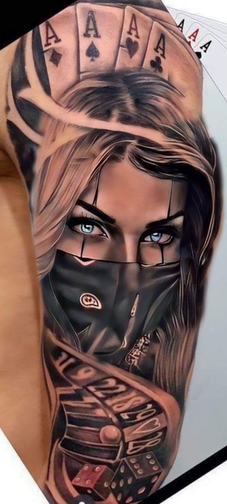 a woman with blue eyes wearing a black mask and playing cards tattoo on her arm