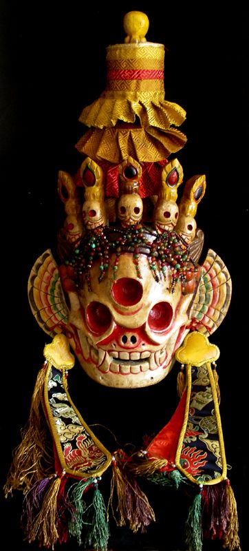 an elaborate mask with many decorations on it