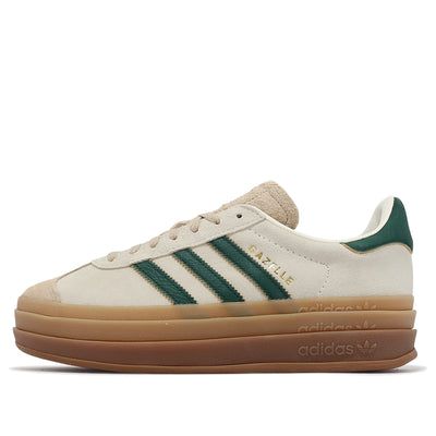 The adidas Gazelle Bold 'Cream Collegiate Green', seamlessly blends neutral tones with the timeless Gazelle style. Crafted with a suede upper, this shoe exudes understated elegance. The mudguard, also in suede, features a slightly deeper shade, adding depth to the design. Dark green leather 3-Stripes adorn the sides, while the classic gum sole in a neutral tan hue ensures comfort and durability. Adidas Gazelle Bold, Gazelle Bold, Bold Shoes, Adidas Originals Gazelle, Fur Heels, Low Air Jordan 1, Adidas Campus, Air Jordan 1 High, Air Jordan 1 Low