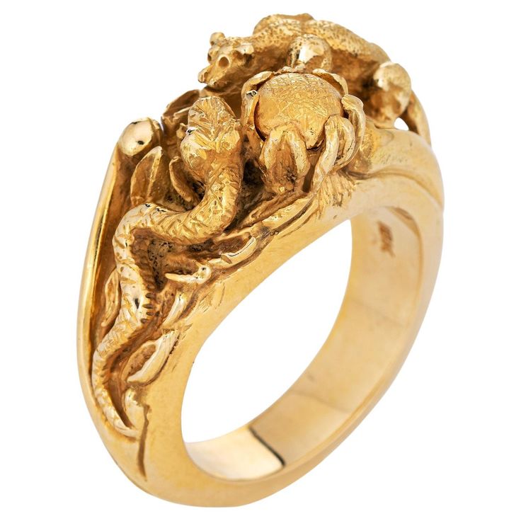 Finely detailed panther & snake ring crafted in 18 karat yellow gold. The elaborate and beautifully detailed ring highlights a panther perched in a predatory position to steal the eggs from the snake's nest. The coiled snake sits in a protective pose by the nest. The lifelike and intricate relief detail of the ring suggest that it was custom made (though the ring does not bear a designer or artisan signature). It's a true work of art. The ring is heavy at 37 grams and has a very weighty feel on Ball Python Ring, Safari Wedding, Best Engagement Rings, Snake Ring, Ring Vintage, Detailed Ring, Ring Crafts, Panther, Luxury Jewelry